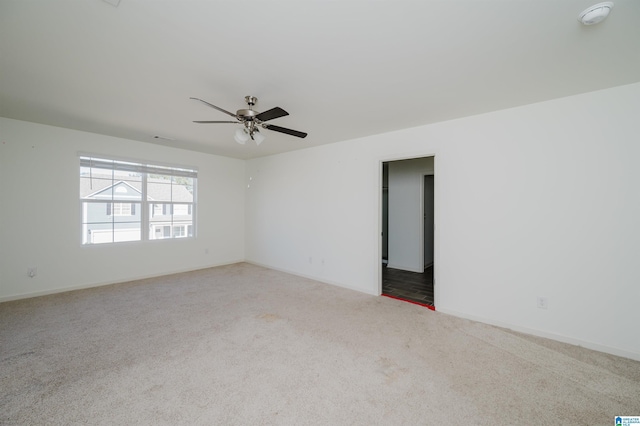 spare room with carpet flooring and ceiling fan