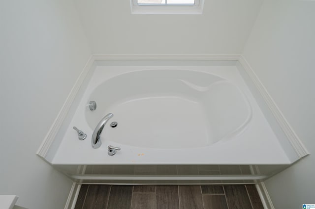 bathroom featuring a tub