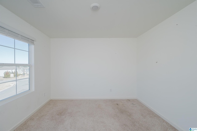 empty room featuring light colored carpet