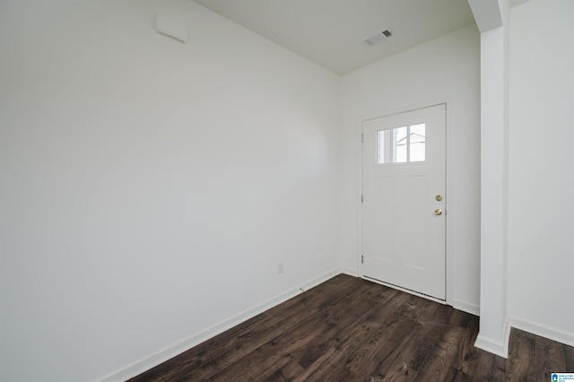 foyer with dark hardwood / wood-style flooring