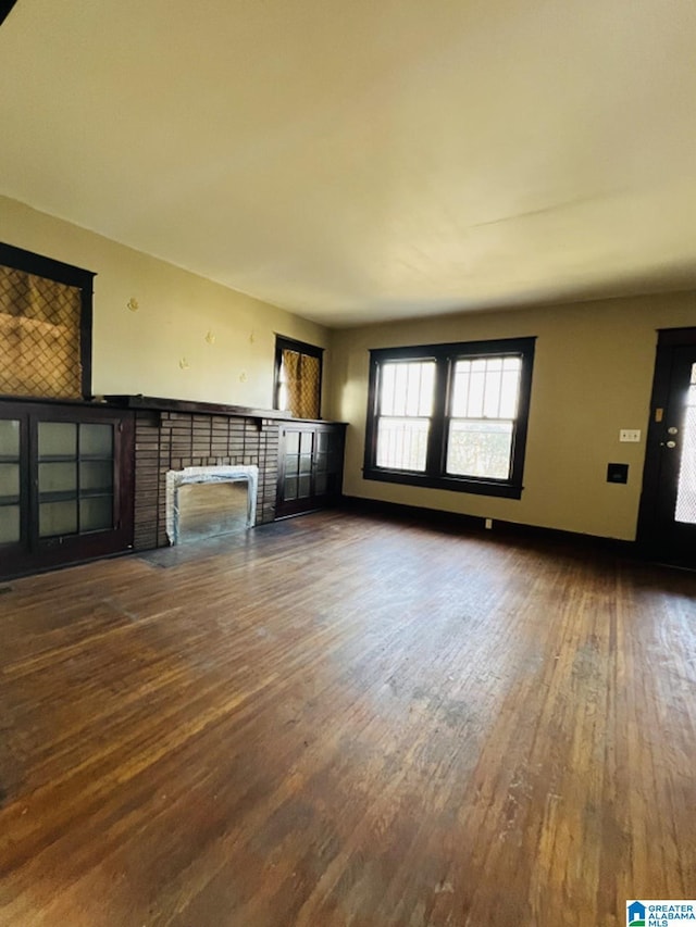 unfurnished living room with hardwood / wood-style floors