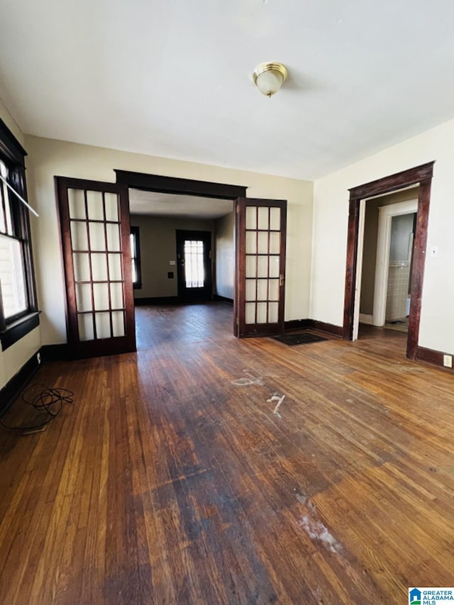 empty room featuring dark hardwood / wood-style flooring