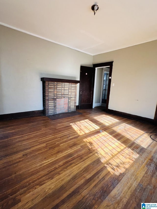 unfurnished living room with dark hardwood / wood-style floors