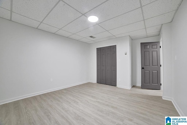 unfurnished bedroom featuring a closet and light hardwood / wood-style flooring