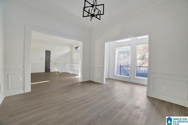 interior space with dark wood-type flooring and crown molding