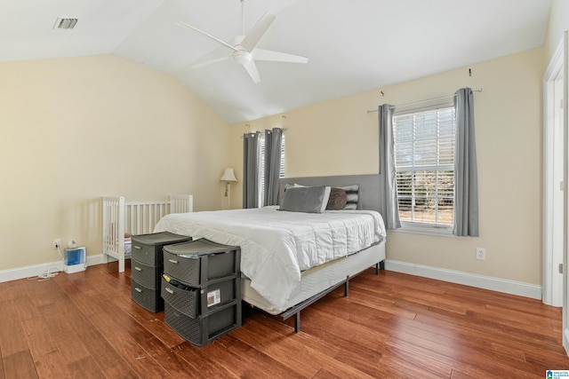 bedroom featuring ceiling fan, vaulted ceiling, and hardwood / wood-style floors