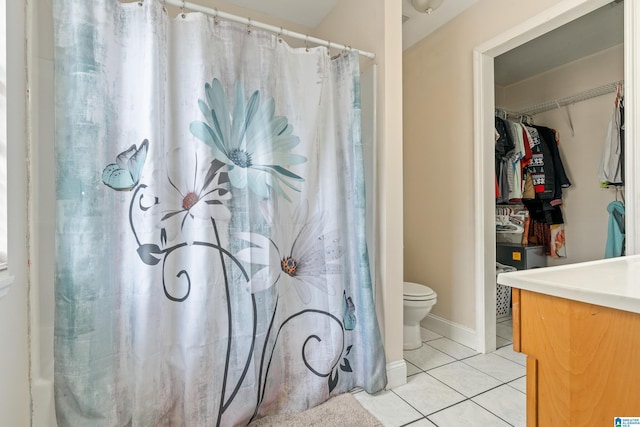 bathroom with tile patterned floors and toilet