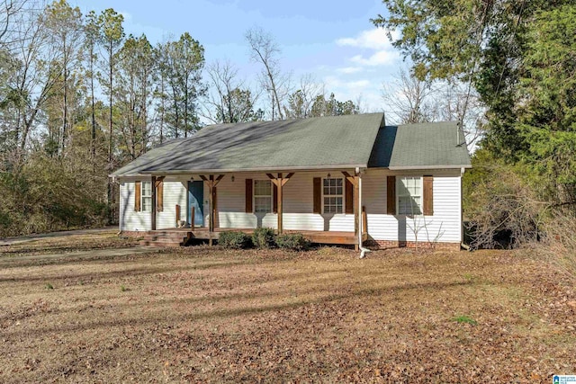 ranch-style house with a porch and a front yard