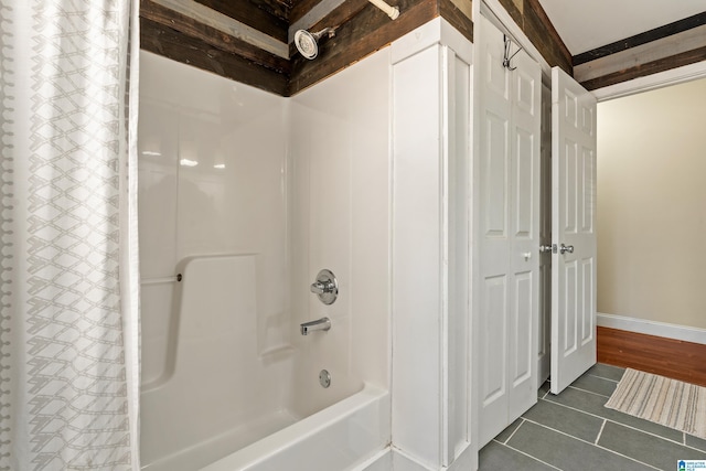 bathroom featuring shower / bath combo and tile patterned floors