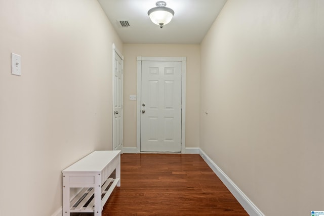 entryway with dark hardwood / wood-style floors