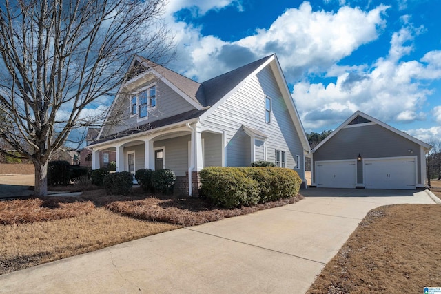 view of front facade featuring a garage and covered porch