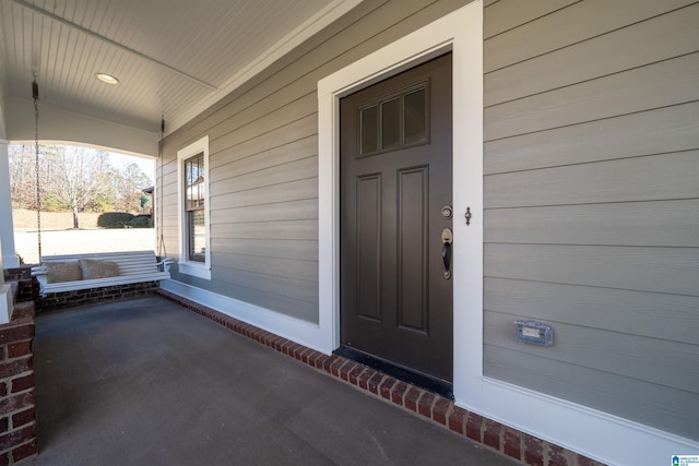 doorway to property featuring a porch