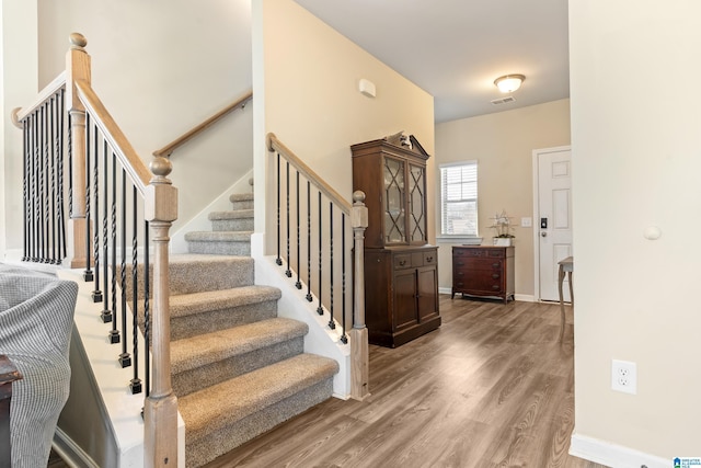 entryway with hardwood / wood-style flooring
