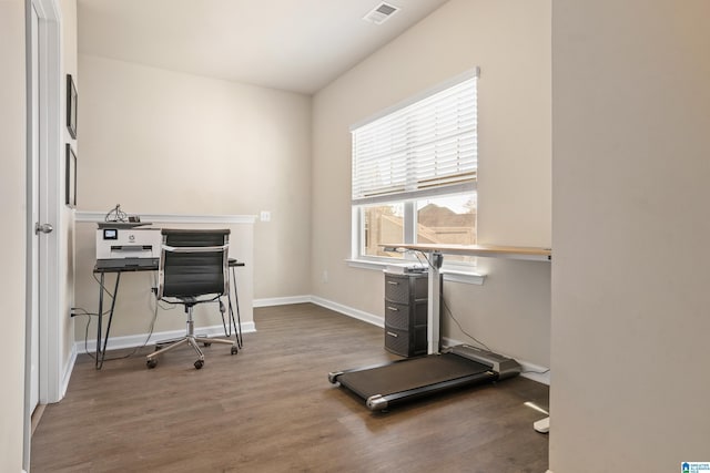 office with dark wood-type flooring