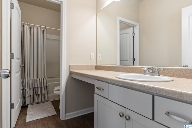 full bathroom featuring vanity, wood-type flooring, shower / bath combo, and toilet