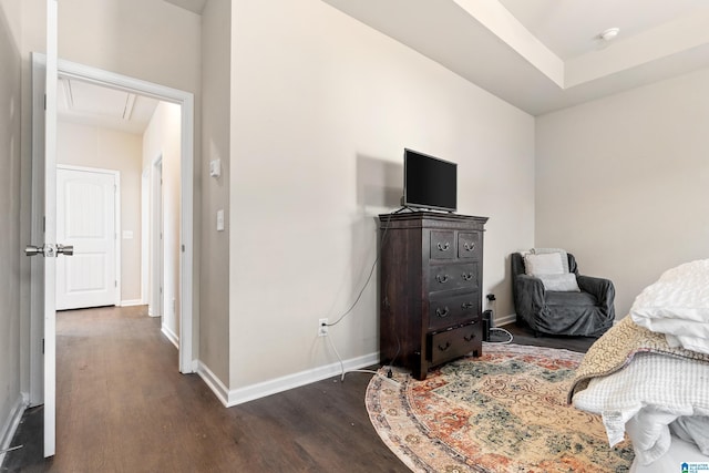 bedroom with dark hardwood / wood-style flooring