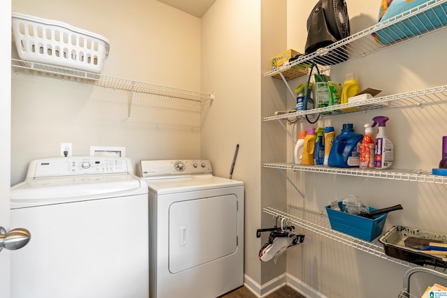 clothes washing area featuring independent washer and dryer