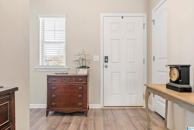 entryway with light hardwood / wood-style floors