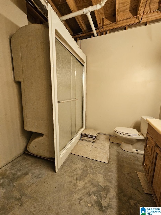 bathroom with toilet, vanity, concrete flooring, and walk in shower