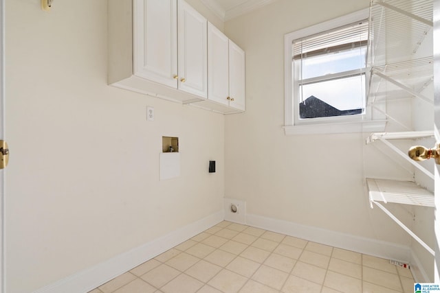 laundry area with light tile patterned flooring, cabinets, hookup for a washing machine, crown molding, and electric dryer hookup