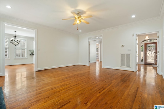 unfurnished living room with crown molding, wood-type flooring, and ceiling fan with notable chandelier