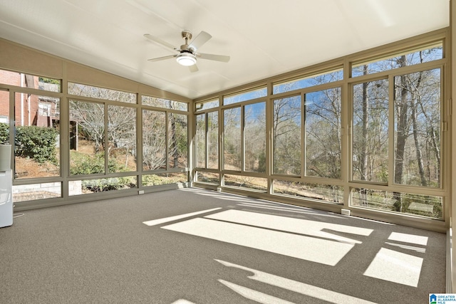 unfurnished sunroom featuring lofted ceiling and ceiling fan