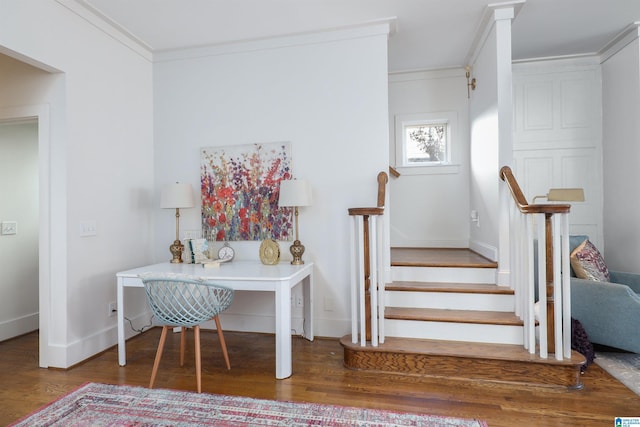 stairs featuring crown molding and hardwood / wood-style floors