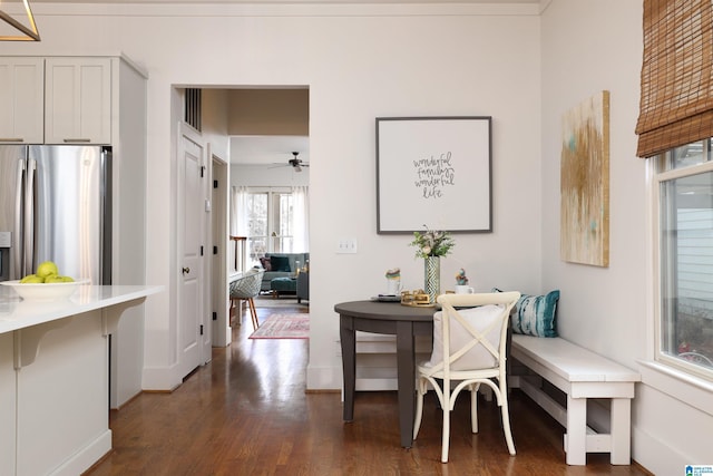 dining room featuring dark hardwood / wood-style floors and ceiling fan