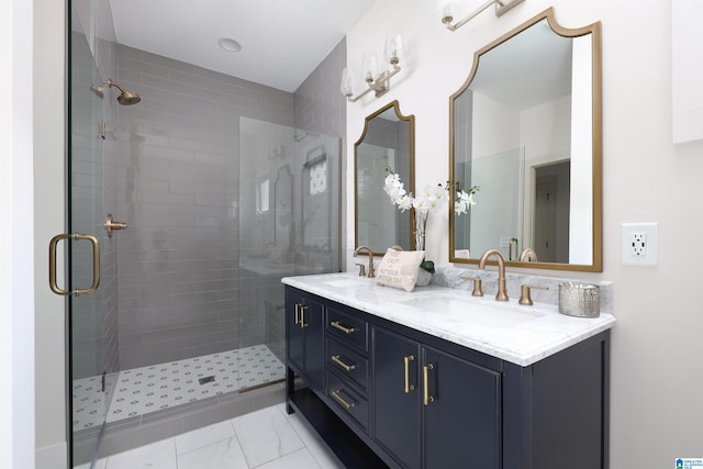 bathroom featuring vanity and a shower with shower door