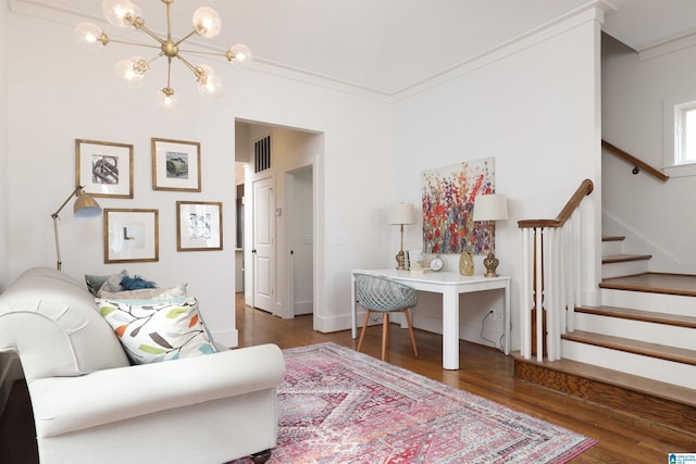 living room with crown molding, an inviting chandelier, and dark wood-type flooring