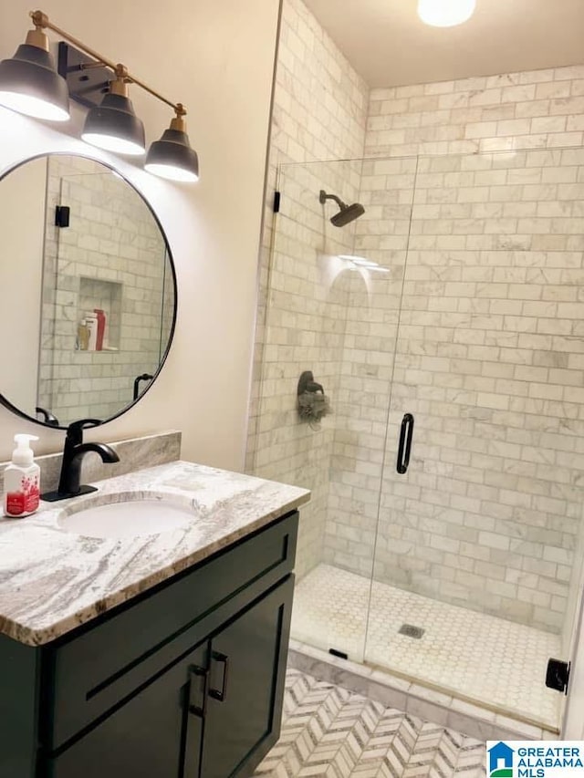 bathroom with vanity and an enclosed shower