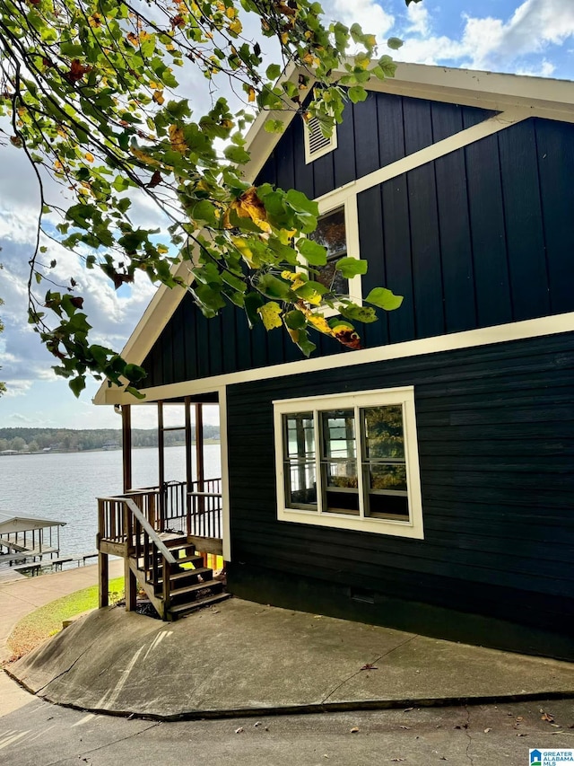 view of side of home featuring a water view