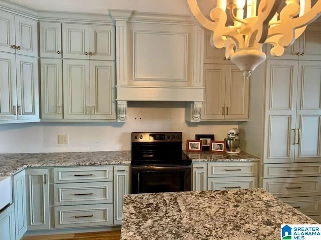 kitchen featuring premium range hood, light stone countertops, black electric range, and pendant lighting