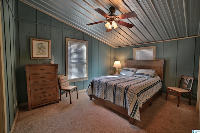 carpeted bedroom featuring ceiling fan, lofted ceiling, and wooden ceiling