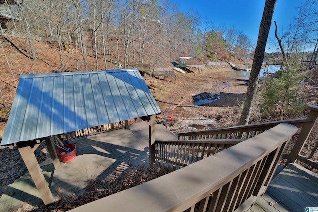 wooden deck featuring a water view