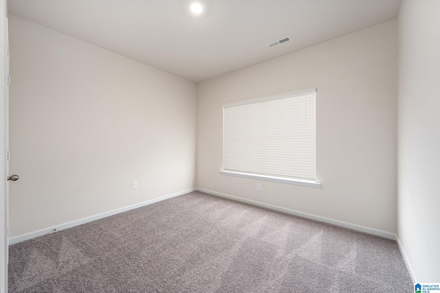 unfurnished room featuring carpet