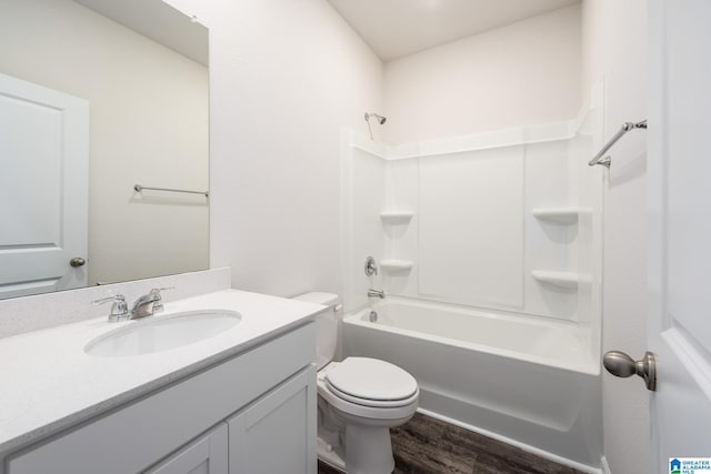 full bathroom featuring vanity, wood-type flooring, shower / washtub combination, and toilet