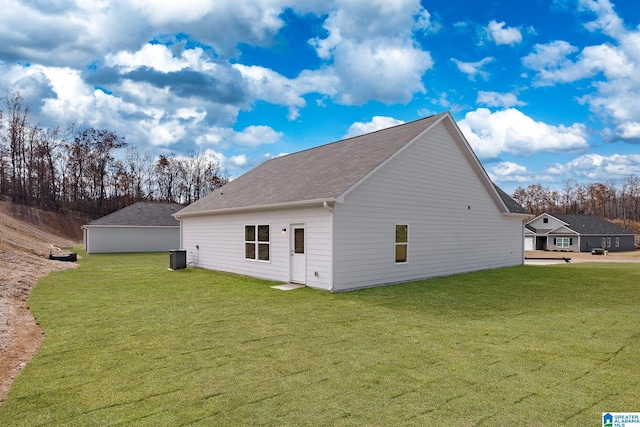 view of home's exterior with a yard and central air condition unit