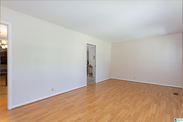 unfurnished room featuring light wood-type flooring