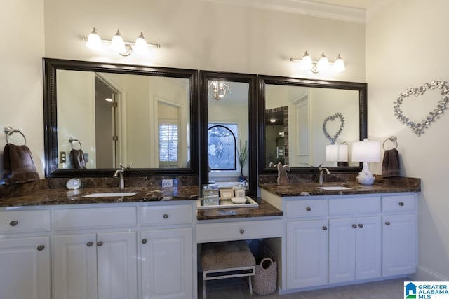 bathroom featuring crown molding and vanity