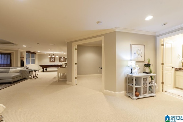 hallway with light carpet and ornamental molding