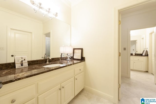 bathroom featuring vanity, tile patterned floors, and ornamental molding