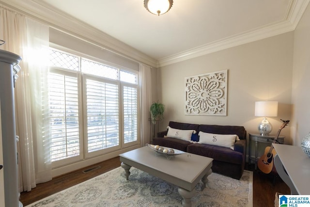 living room featuring ornamental molding and dark hardwood / wood-style flooring