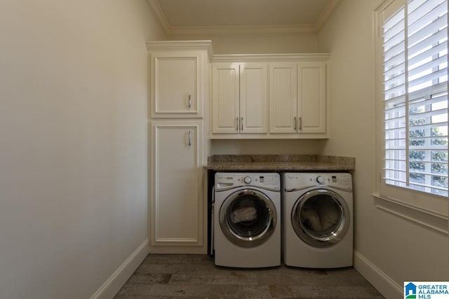 washroom with cabinets, ornamental molding, and independent washer and dryer