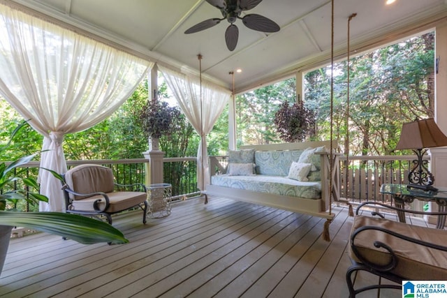 wooden terrace with outdoor lounge area and ceiling fan