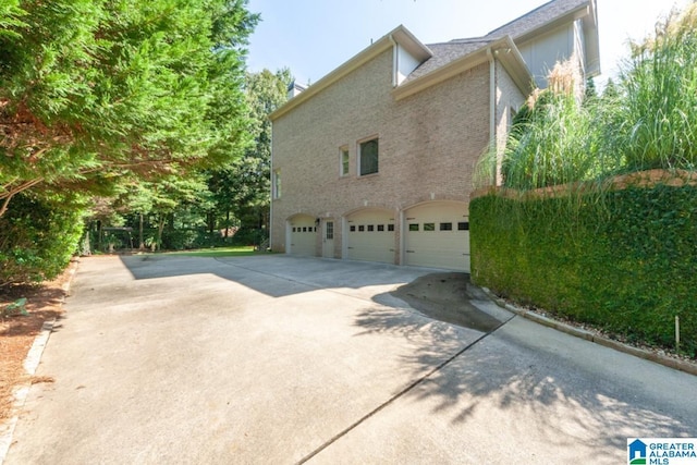 view of property exterior with a garage