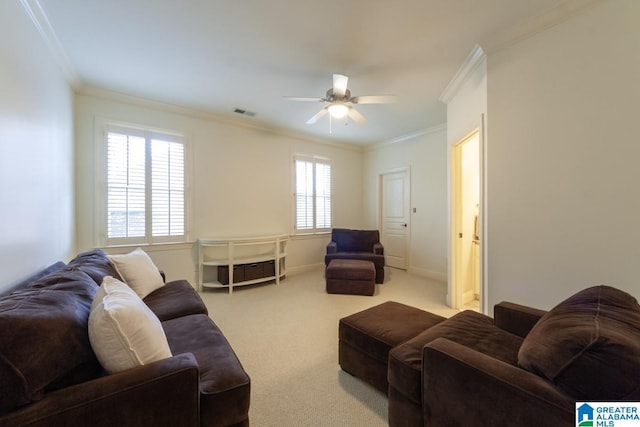 carpeted living room with ornamental molding and ceiling fan