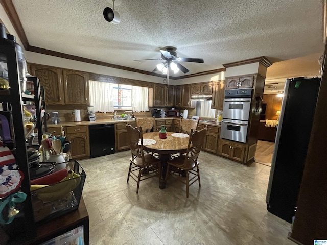 dining area featuring crown molding, sink, a textured ceiling, and ceiling fan