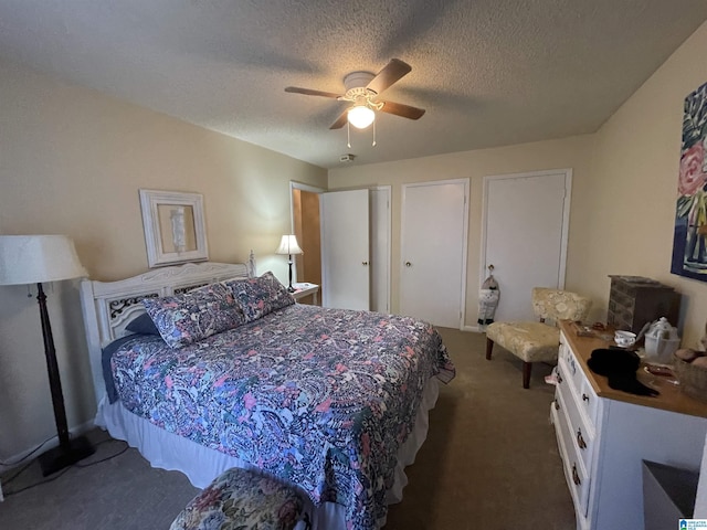 carpeted bedroom featuring ceiling fan and a textured ceiling