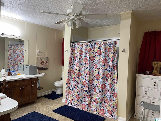 bathroom with vanity, toilet, a shower with shower curtain, and a textured ceiling